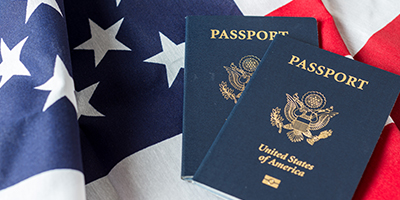 United States of America passports on American flag